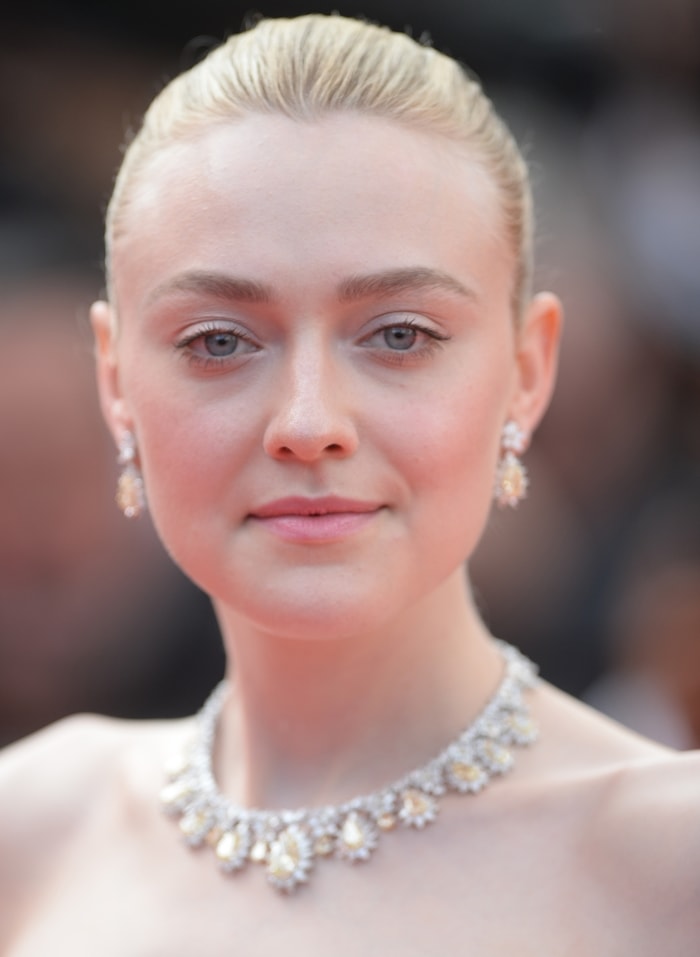 Dakota Fanning wears Chopard jewelry on the red carpet at the Once Upon A Time In Hollywood premiere