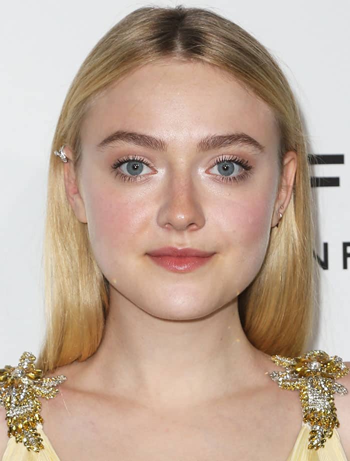 Dakota Fanning wore her blonde hair straight and sported soft, feminine makeup