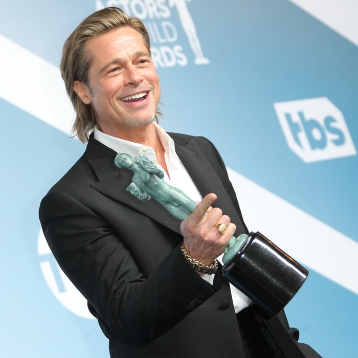 Brad Pitt celebrates his win for Outstanding Performance by a Male Actor in a Supporting Role at the 2020 Screen Actors Guild Awards