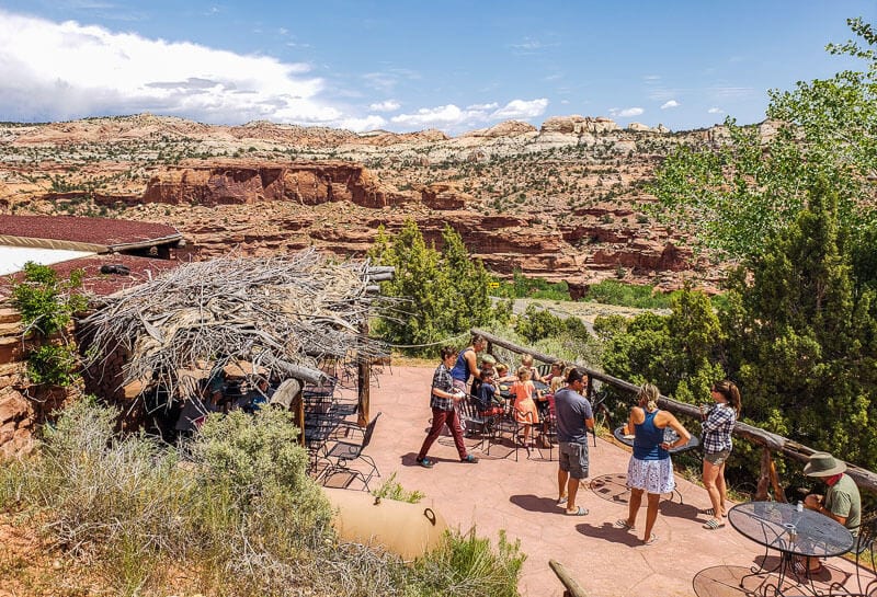 A group of people walking down a dirt road