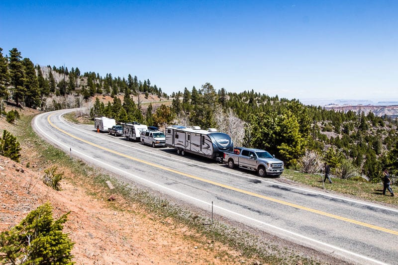 cars and mobile homes on the side of the road