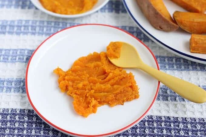 mashed roasted sweet potato on white kids plate