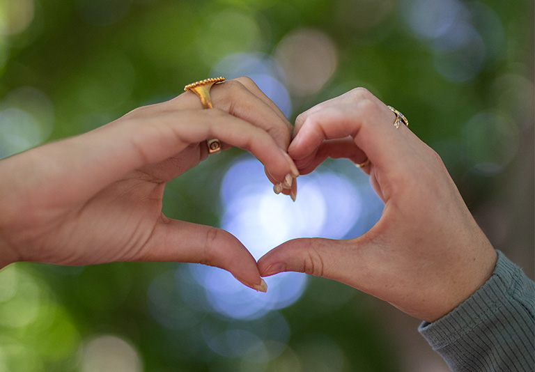 two hands making a heart