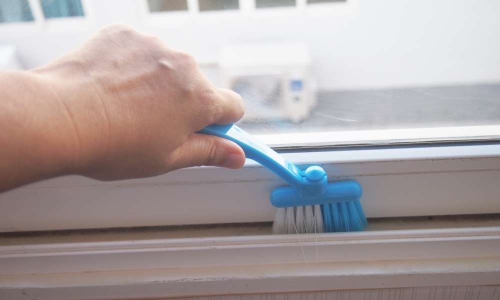 Use a Toothbrush to Clean Dirt And Debris From The Track